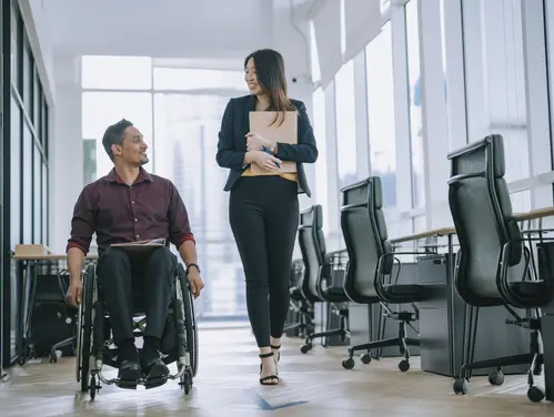 Person in Wheelchair getting support in the workplace