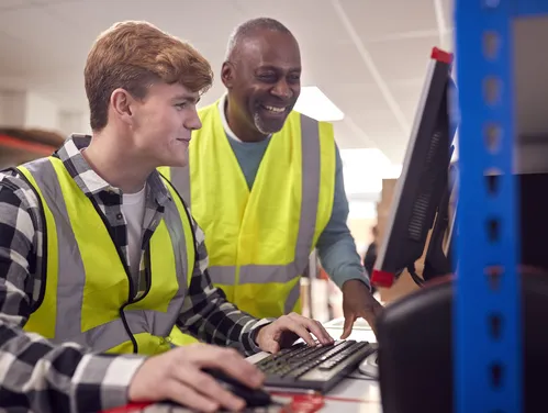 An apprentice getting experience on the job.