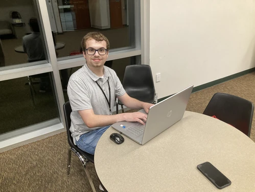 Garrett Pierce at computer.