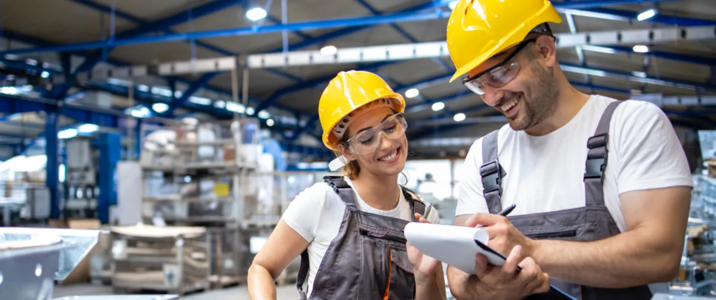 Man and a women learning on the job.