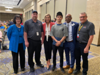 Photo of Governor Reynolds, Director Beth Townsend, Apprentices and Staff from the Quad Cities.
