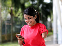 woman with one arm making phone call