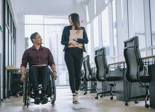 Person in Wheelchair getting support in the workplace