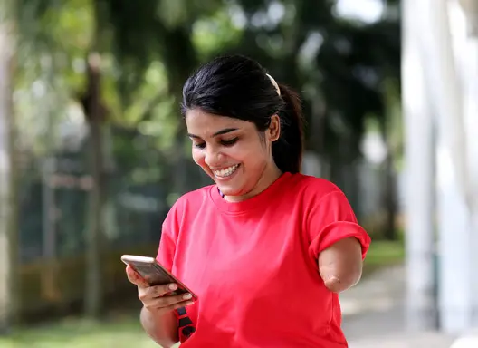 woman with one arm making phone call