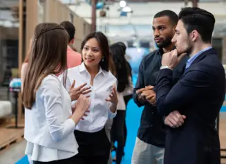 Workers conversing in the workplace