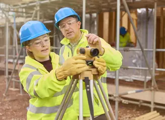 A photo of a intern on the job learning a new skill.