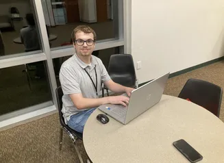 Garrett Pierce at computer.