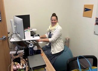 Margaux John sitting in her office