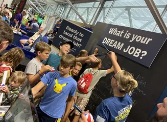 Young Iowans at the Iowa Workforce Development Fair Booth